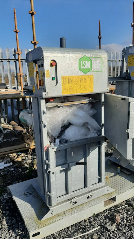 LSM balers helping to improve sustainability in the building sector - fitting the baler with materials for compression