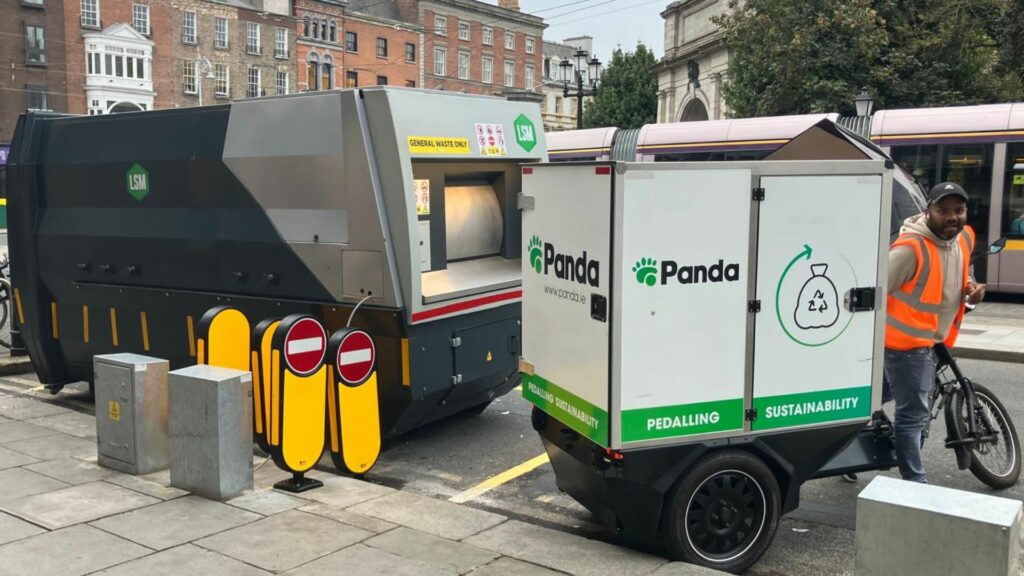 Panda using LSM ECargo bike beside LSM Waste Compactor 